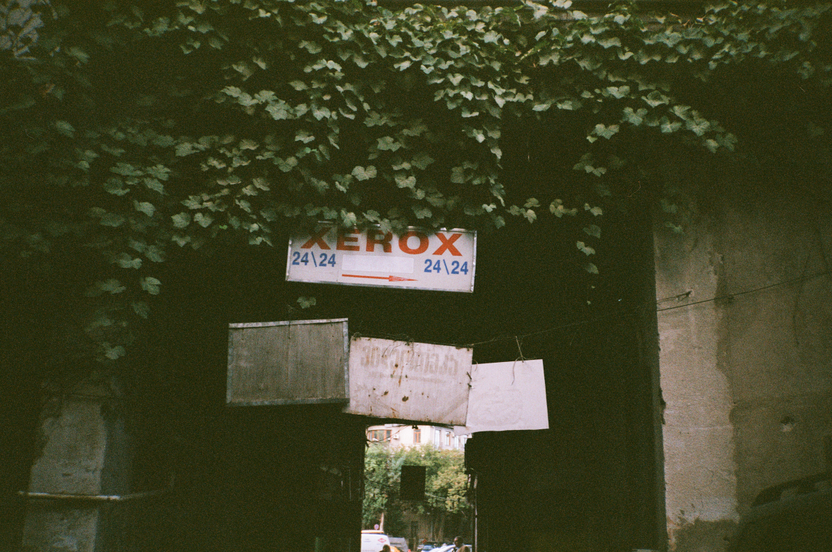 an old sign saying xerox on a viny wall in tbilisi georgia