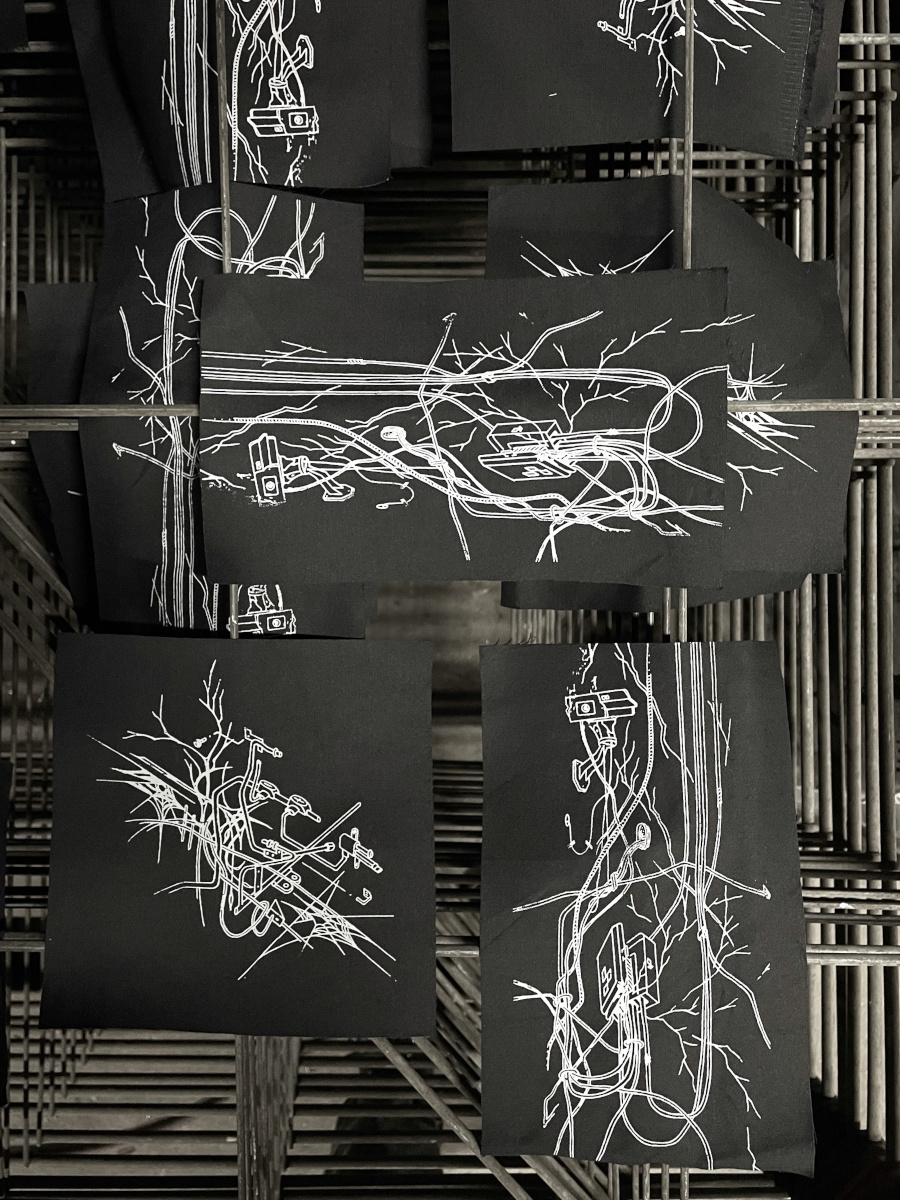 screenprinted patches drying on a rack