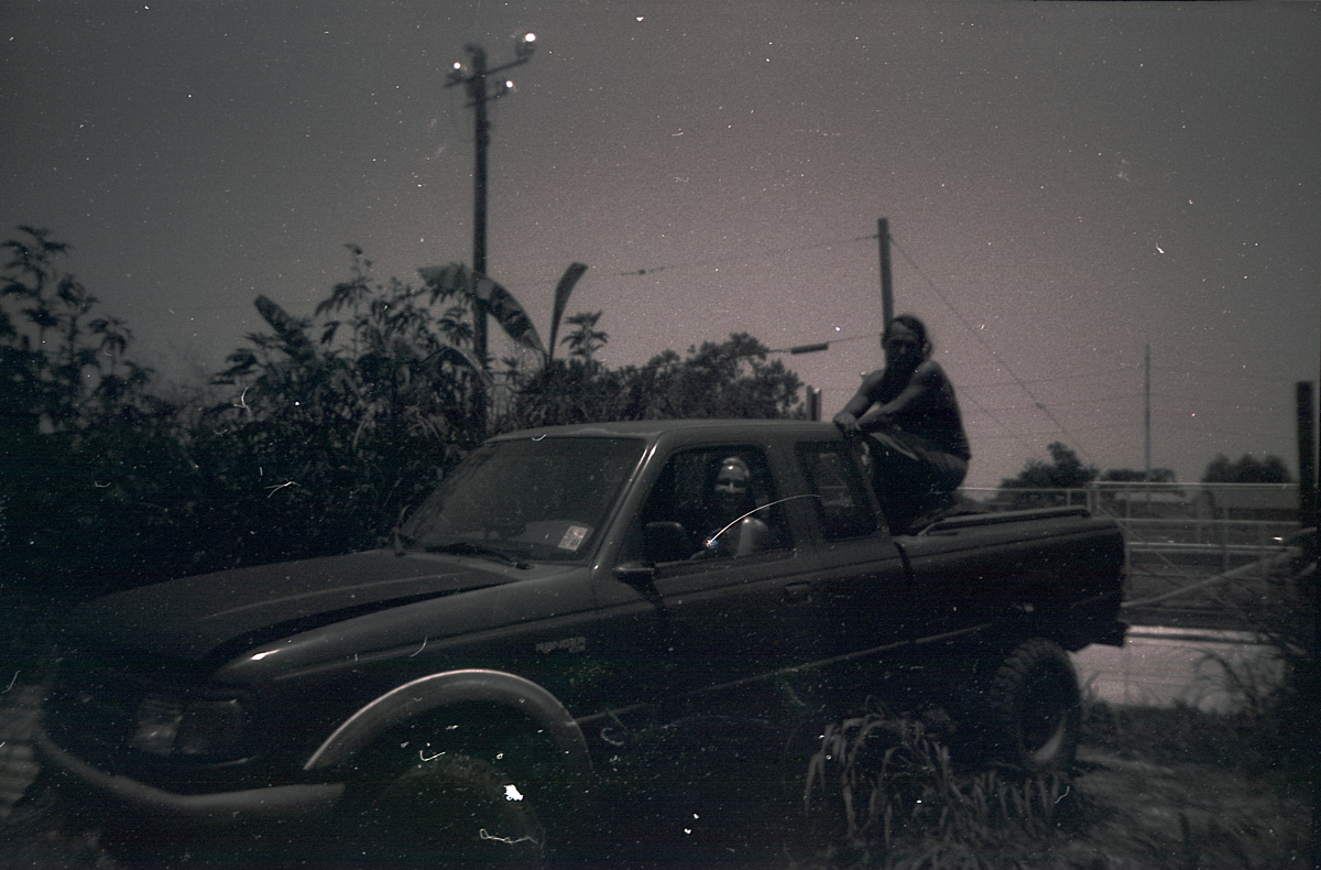 black and white photo of two people in a ford ranger