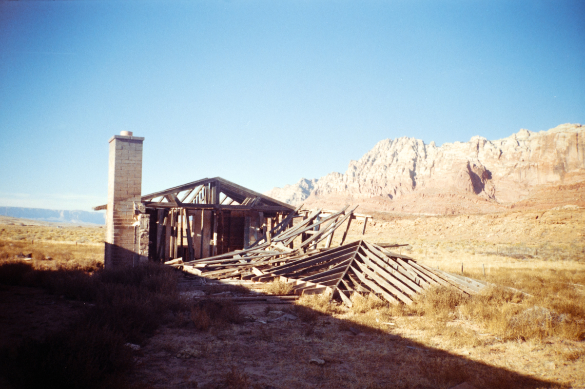 abandoned wooden house in arizona with harsh shadows