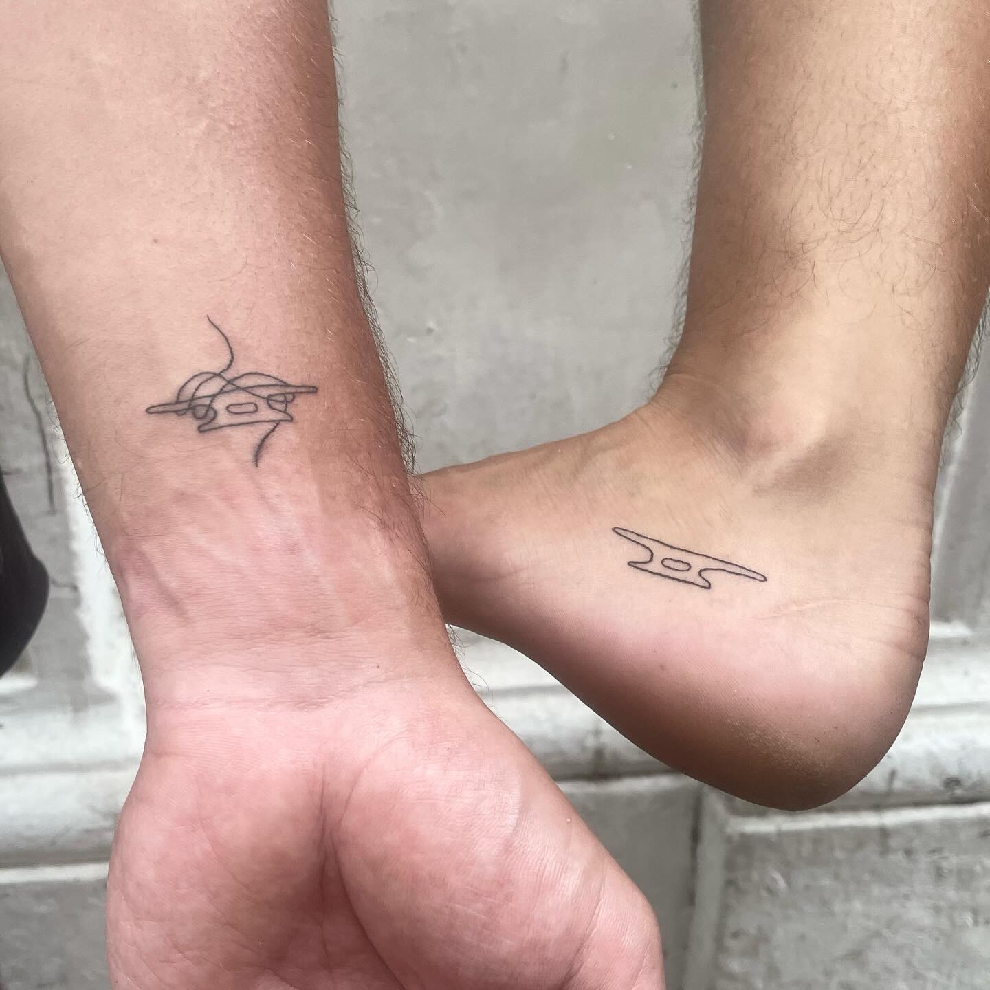 tattoo of a small design on inside of ear