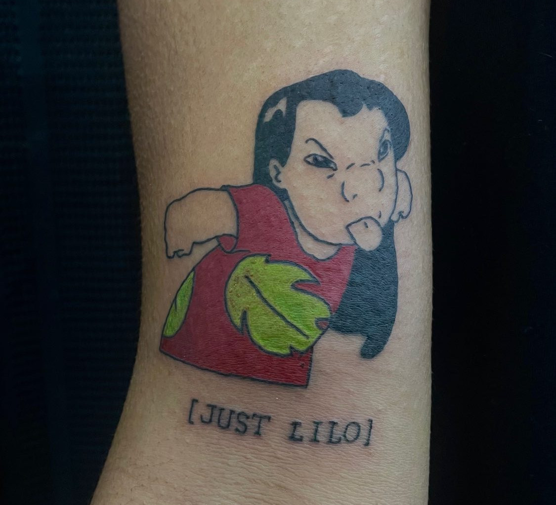 tattoo of lilo from lilo and stitch on an arm